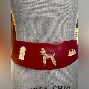 Genuine 1950’s red leather belt. Measures from buckle to first hole.